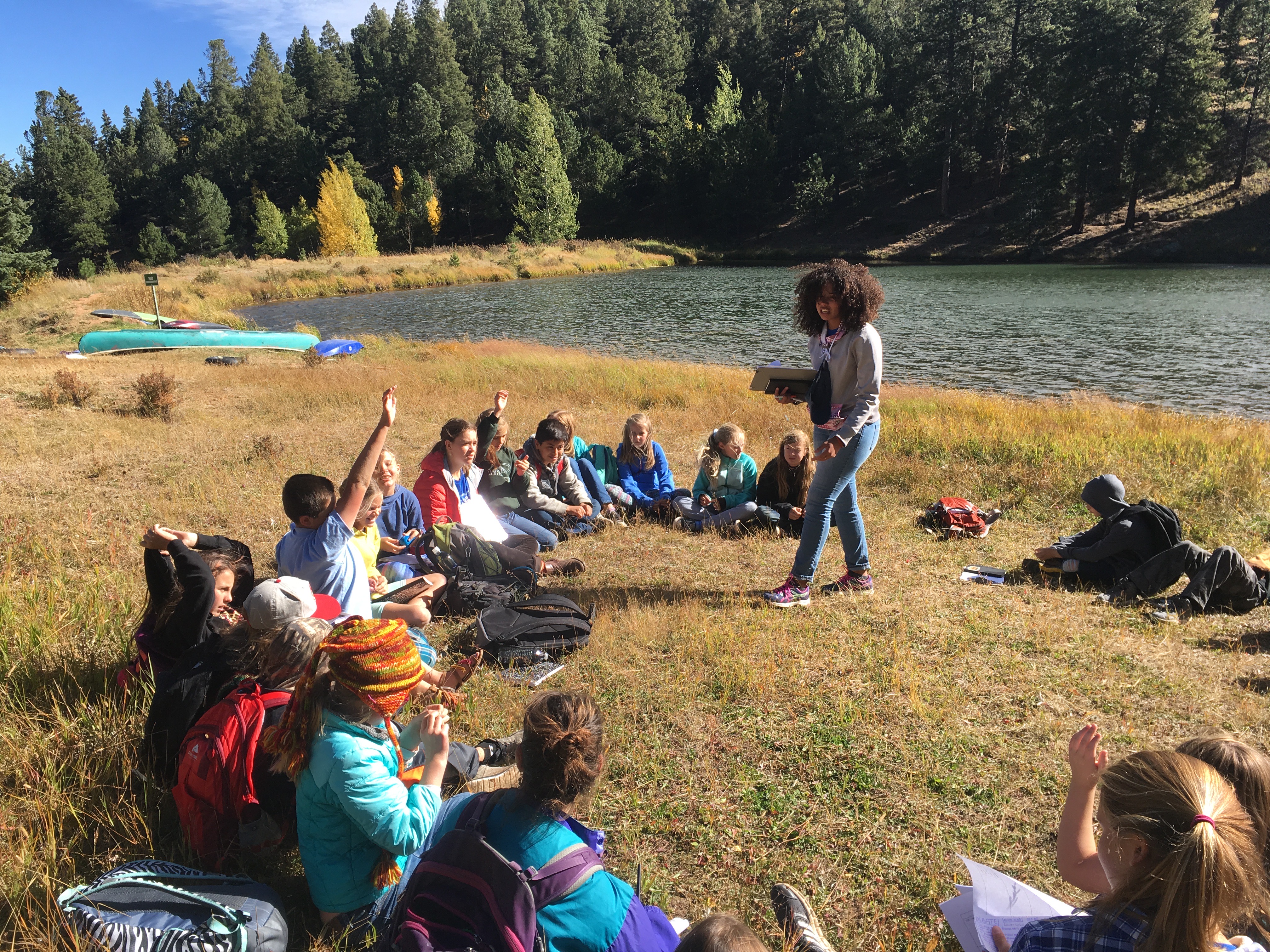 An environmental educator teaches a group of students