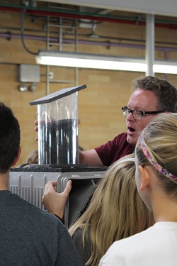 Water educator Matt Bond demonstrates a water activity with students