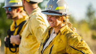 A firefighter smiles after a prescribed fire at Balcones Canyonlands National Wildlife Refuge in Texas.