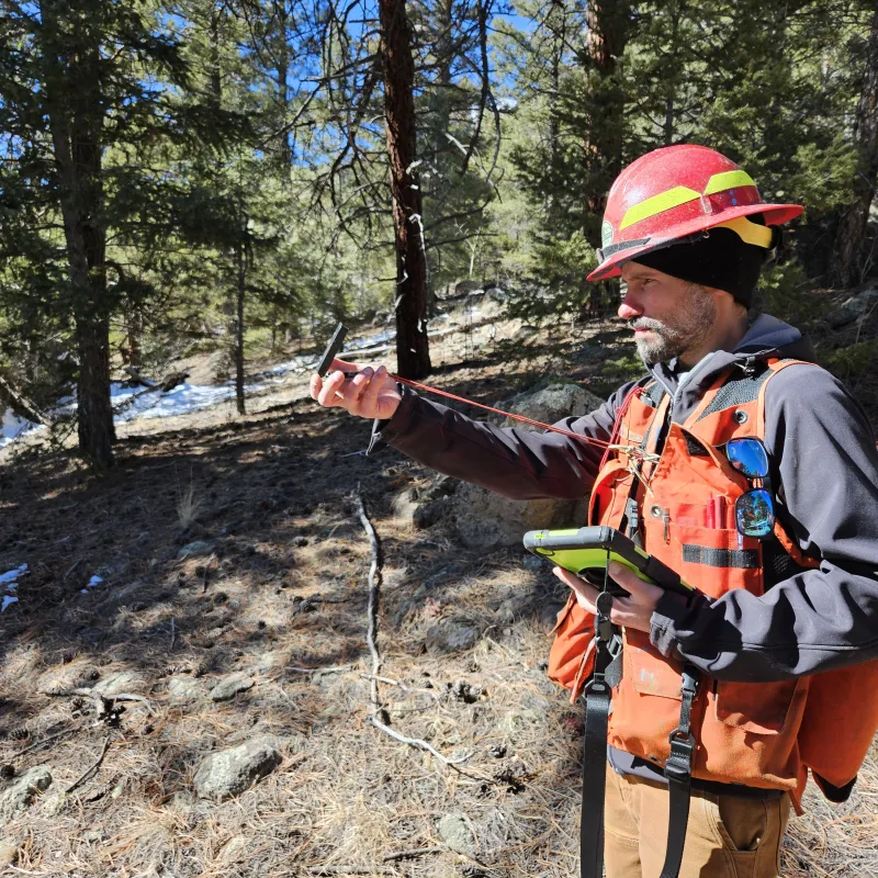A forestry technician gets to work in a forest